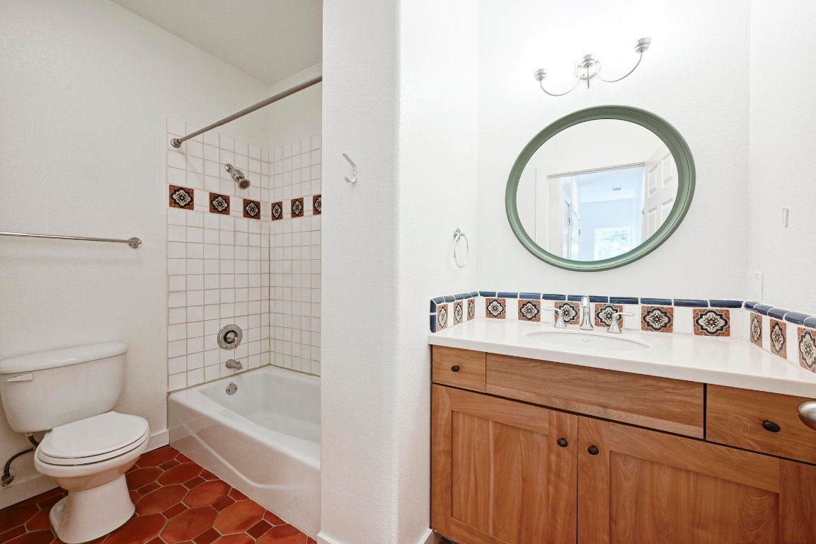 2705 Bonnie Road, Unit A Austin, TX 78703 - Photo 12 of 18 a bathroom with a toilet sink and mirror