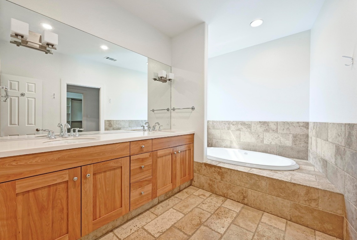 2705 Bonnie Road, Unit A Austin, TX 78703 - Photo 14 of 18 a bathroom with a sink a toilet and bathtub