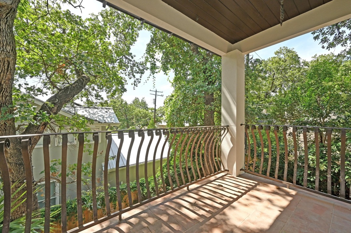 2705 Bonnie Road, Unit A Austin, TX 78703 - Photo 16 of 18 a balcony with trees in front of it
