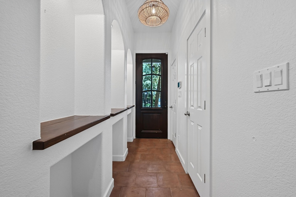 2705 Bonnie Road, Unit A Austin, TX 78703 - Photo 3 of 18 a hallway with windows and wooden floor