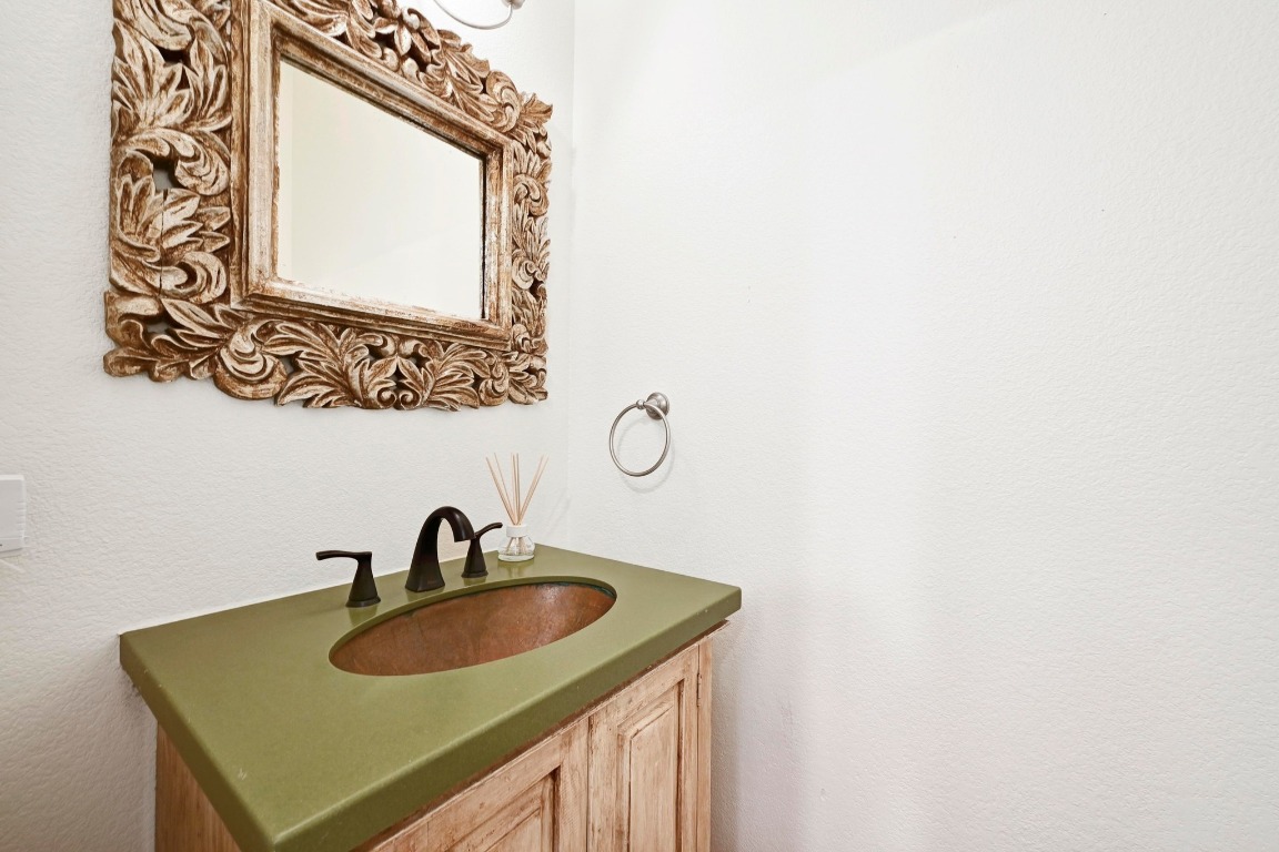 2705 Bonnie Road, Unit A Austin, TX 78703 - Photo 9 of 18 a bathroom with a sink and a mirror