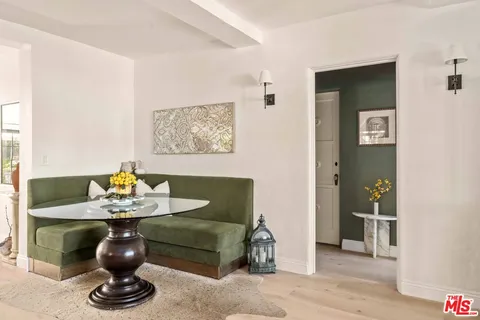 a kitchen with a sink and a large mirror