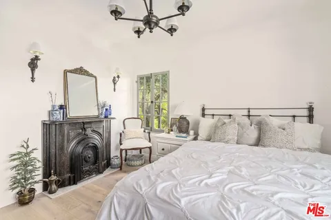 a bathroom with a sink a large mirror and a bathtub