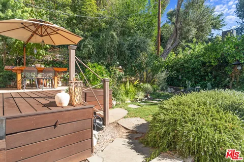 an aerial view of multiple house with a yard
