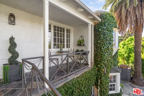 a kitchen with kitchen island granite countertop a table and chairs in it