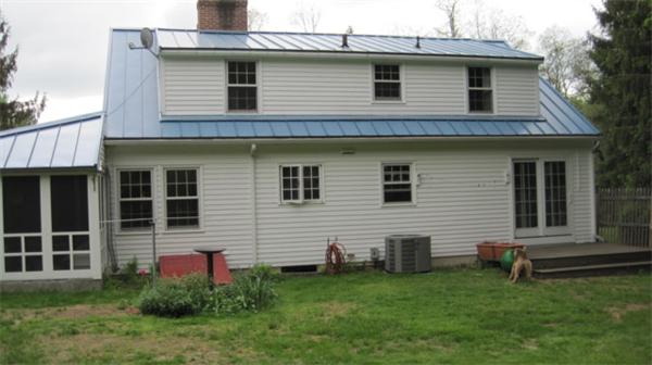 75 Amherst Road Leverett, MA 01054 - Photo 15 of 22 a front view of a house with a garden