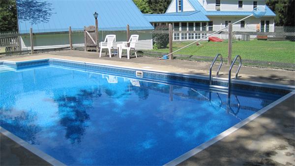 75 Amherst Road Leverett, MA 01054 - Photo 19 of 22 a view of a patio with a table and chairs under an umbrella