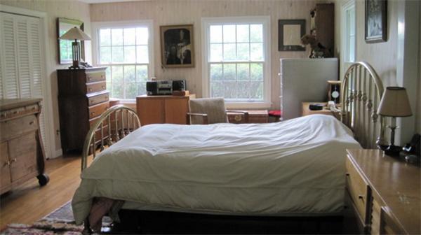 75 Amherst Road Leverett, MA 01054 - Photo 9 of 22 a bed sitting in a bedroom next to a window