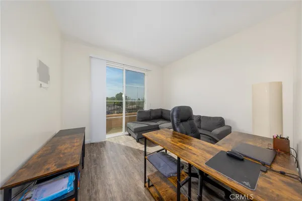 a workspace with furniture and wooden floor