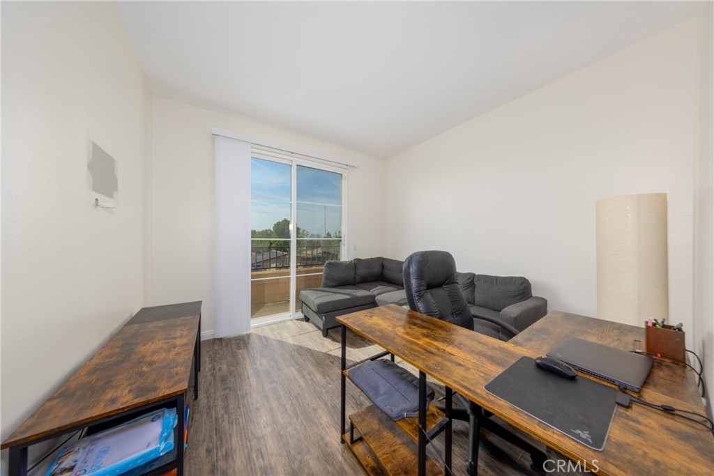 12068 Preston Street Grand Terrace, CA 92313 - Photo 18 of 34 a workspace with furniture and wooden floor