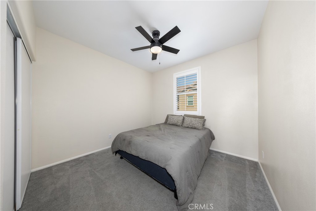 12068 Preston Street Grand Terrace, CA 92313 - Photo 22 of 34 a bedroom with a bed and window
