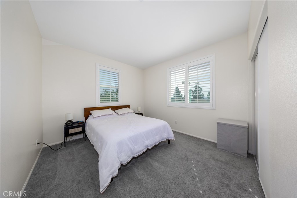 12068 Preston Street Grand Terrace, CA 92313 - Photo 27 of 34 a bedroom with a bed and window