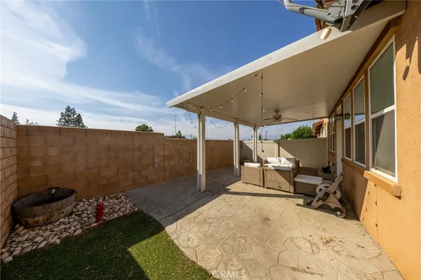 a view of a backyard with sitting area