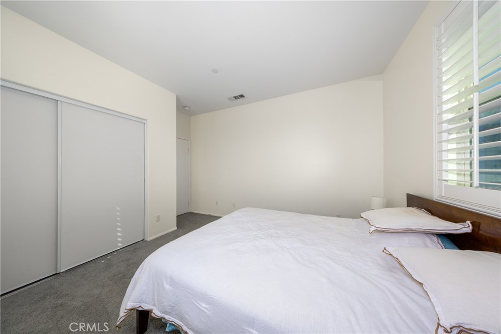 12068 Preston Street Grand Terrace, CA 92313 - Photo 34 of 34 a bedroom with a bed and window