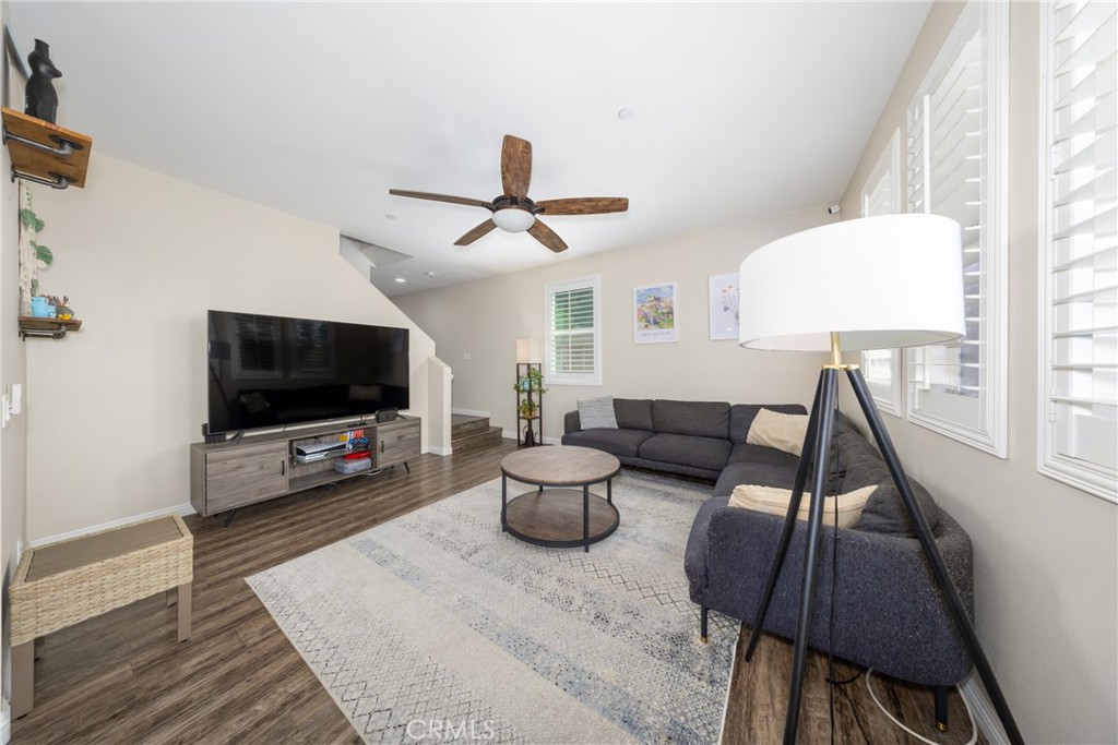 12068 Preston Street Grand Terrace, CA 92313 - Photo 7 of 34 a living room with furniture and a flat screen tv