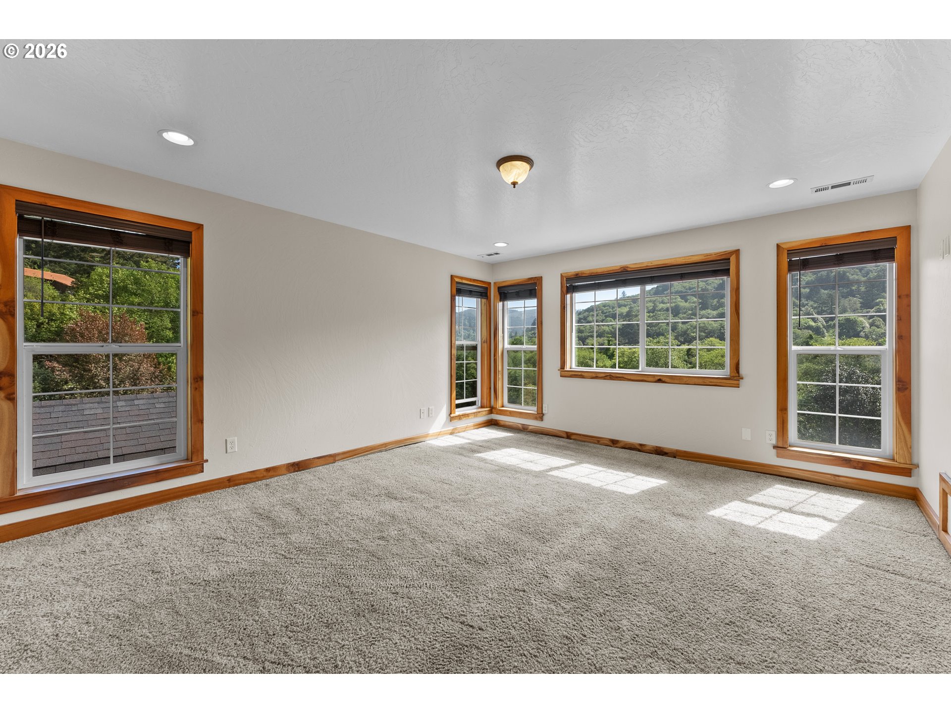 16711 Thompson Road Brookings, OR 97415 - Photo 18 of 45 a view of an empty room with a window