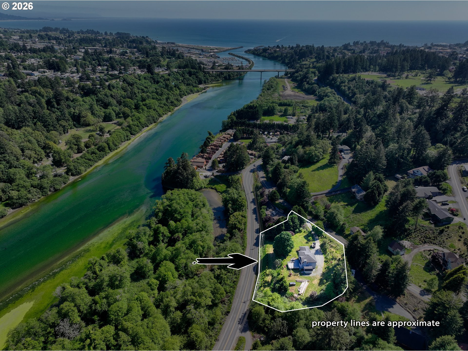 16711 Thompson Road Brookings, OR 97415 - Photo 2 of 45 an aerial view of a residential houses with outdoor space and trees