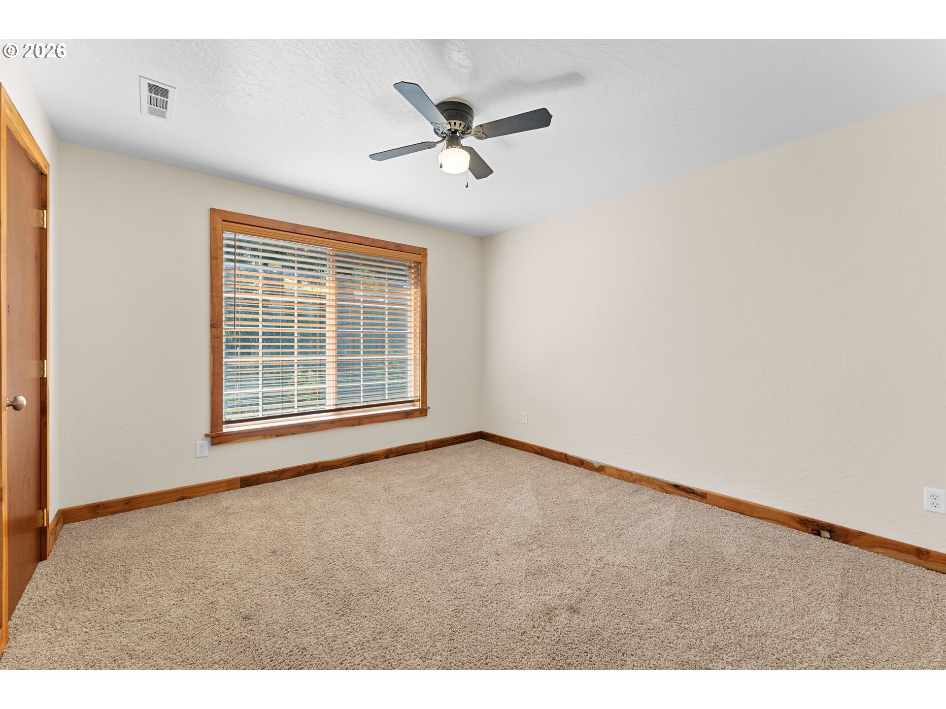 16711 Thompson Road Brookings, OR 97415 - Photo 27 of 45 a view of an empty room with a window