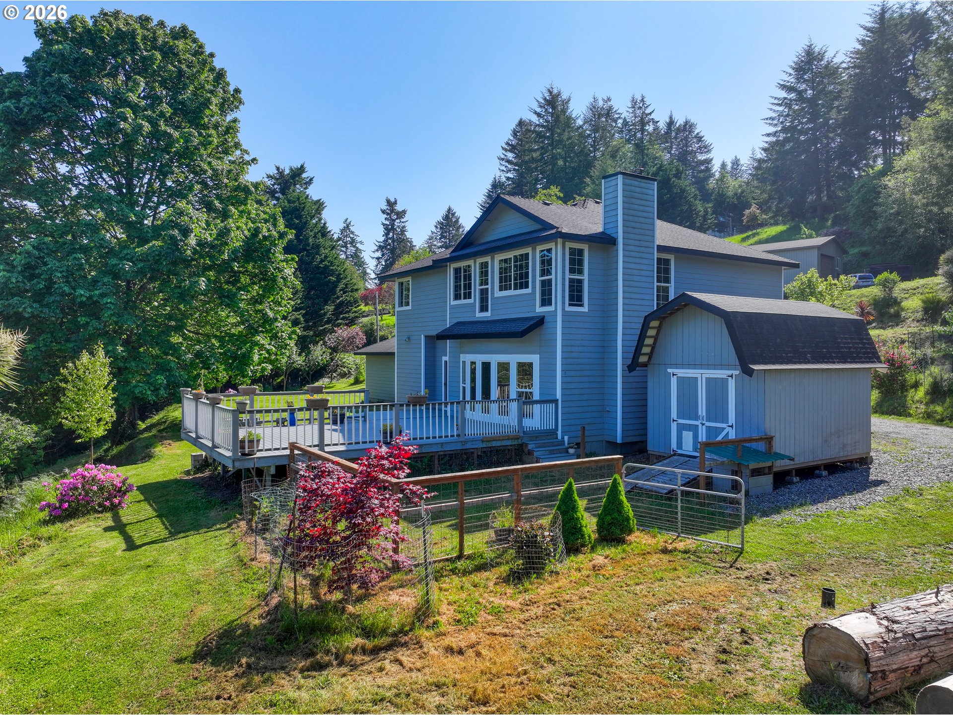 16711 Thompson Road Brookings, OR 97415 - Photo 38 of 45 a front view of a house with garden