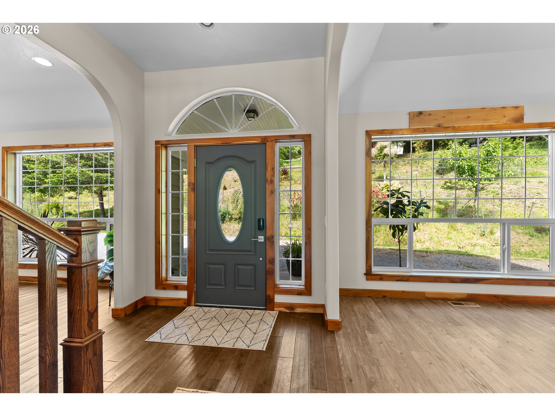 16711 Thompson Road Brookings, OR 97415 - Photo 6 of 45 a view of livingroom with furniture window wooden floor and front door