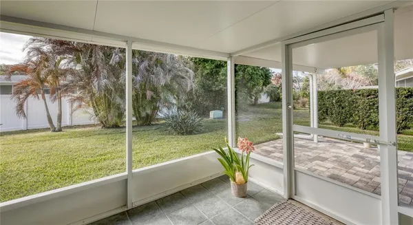 a view of a room with yard from balcony