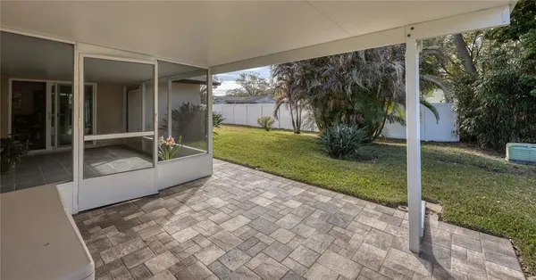 a view of a porch with backyard and garden