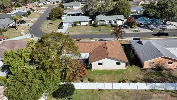 an aerial view of a house with a swimming pool