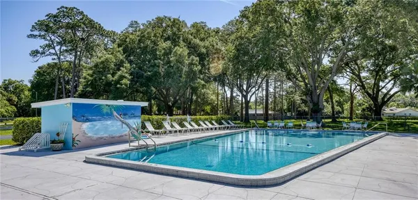 a view of a swimming pool with a patio