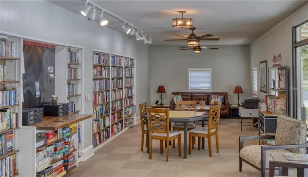 a view of a livingroom with furniture and a window