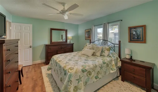 a bedroom with a bed and a dresser