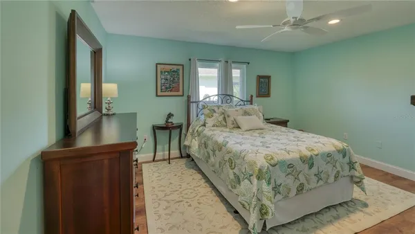 a bedroom with a bed and a desk