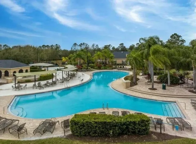 a view of a swimming pool with a patio