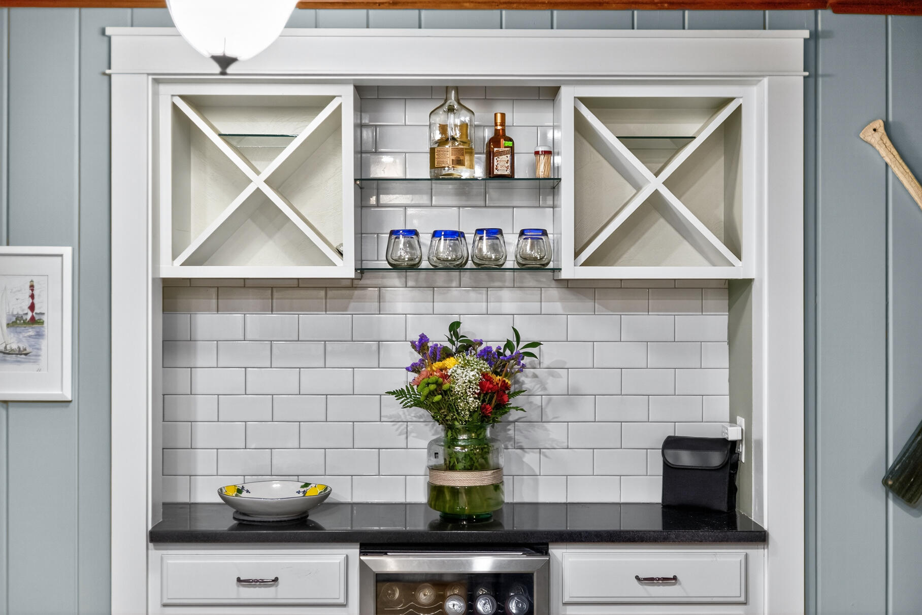 23 Childs River Road East Falmouth, MA 02536 - Photo 13 of 34 a kitchen with a microwave a sink and a stove with white wooden cabinets