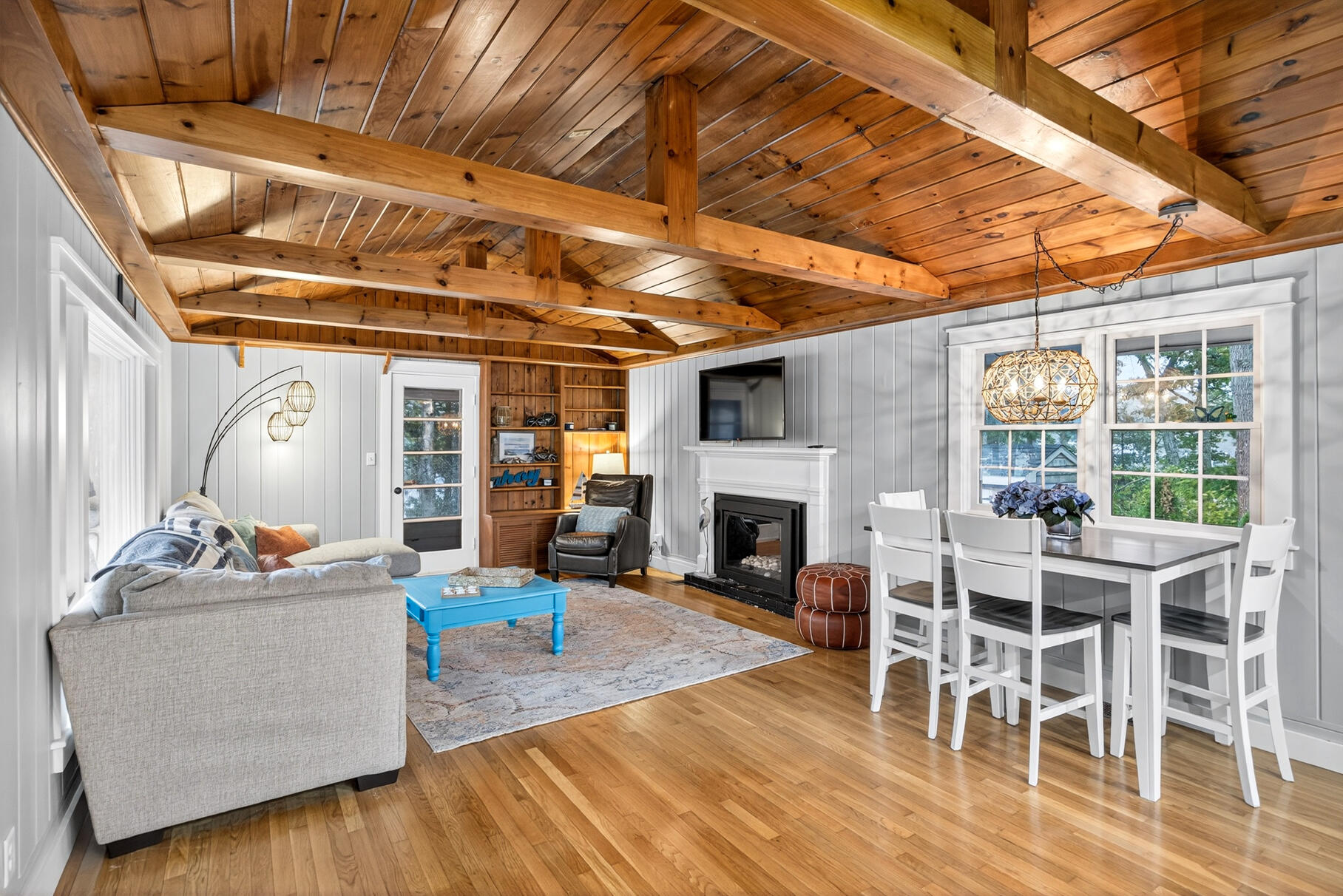 23 Childs River Road East Falmouth, MA 02536 - Photo 15 of 34 a living room with furniture a fireplace and a table