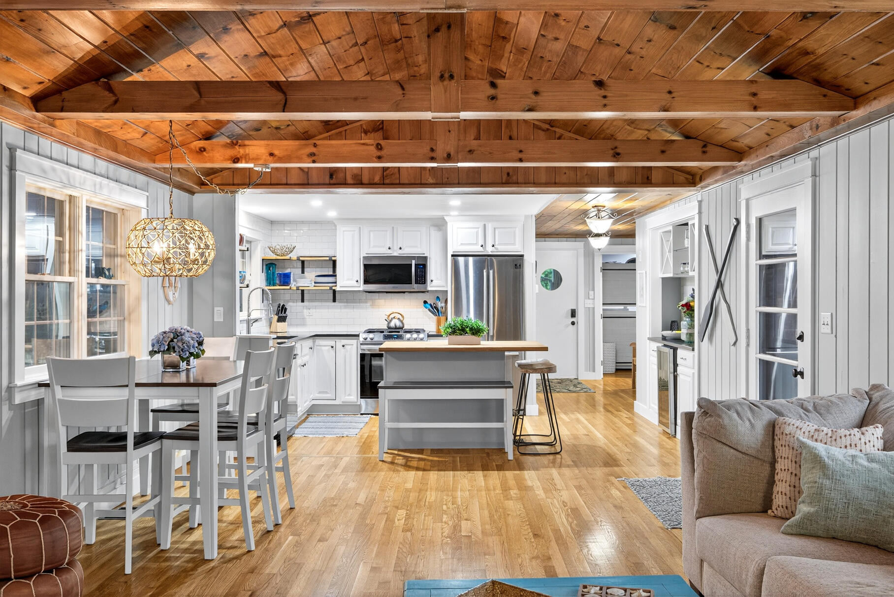 23 Childs River Road East Falmouth, MA 02536 - Photo 16 of 34 a living room with furniture and a chandelier