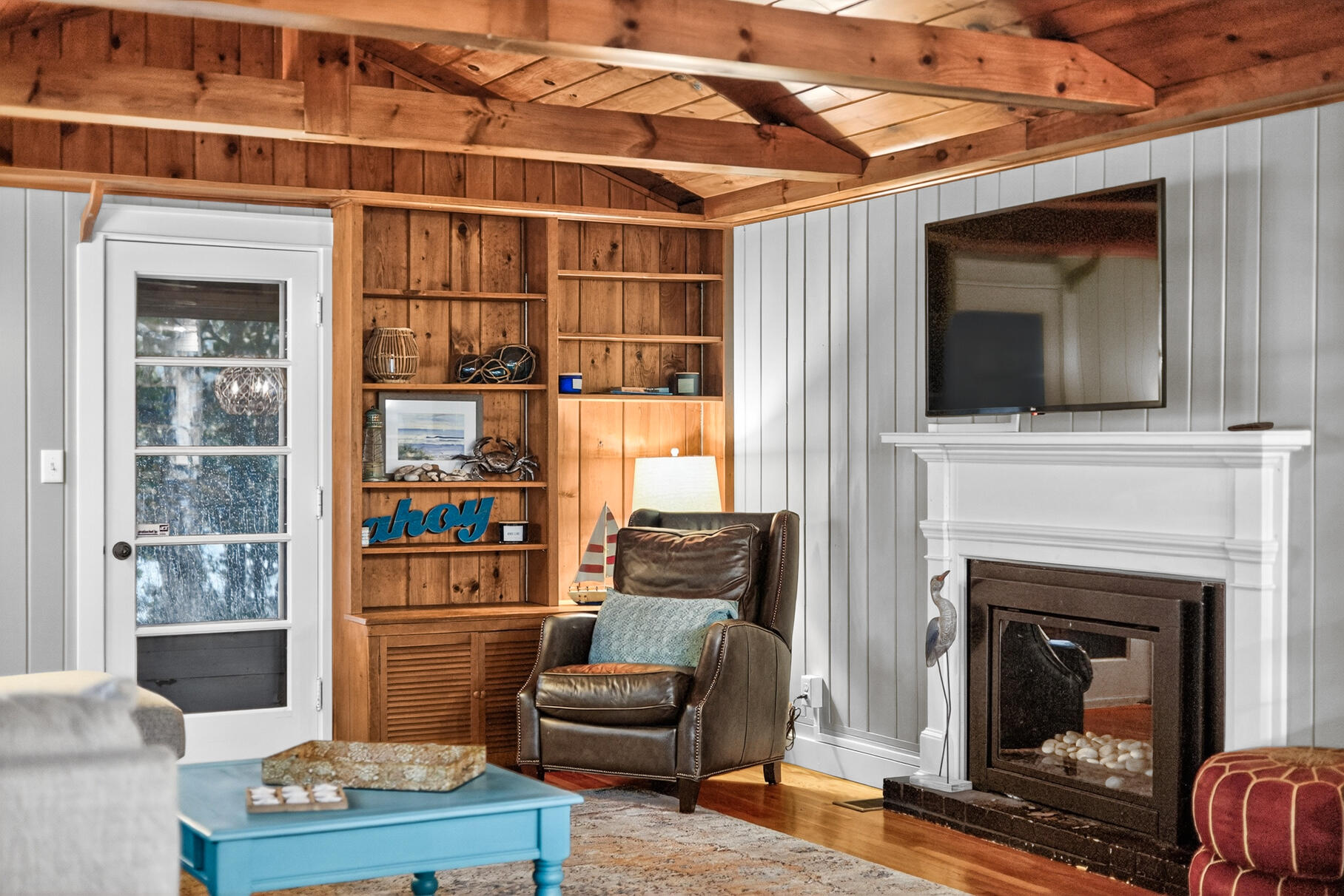 23 Childs River Road East Falmouth, MA 02536 - Photo 21 of 34 a living room with furniture and a fireplace
