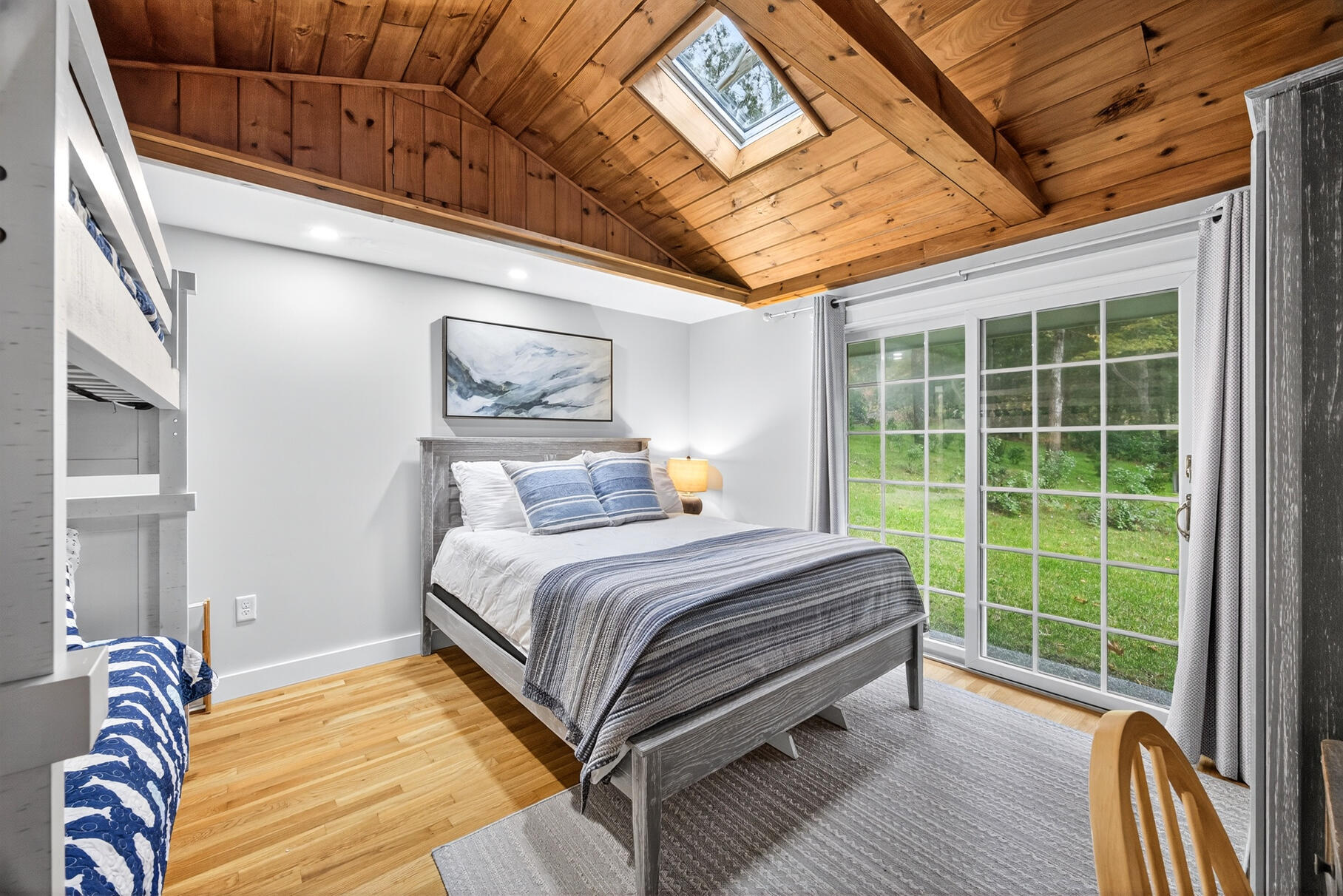 23 Childs River Road East Falmouth, MA 02536 - Photo 24 of 34 a bed sitting in a bedroom next to a window