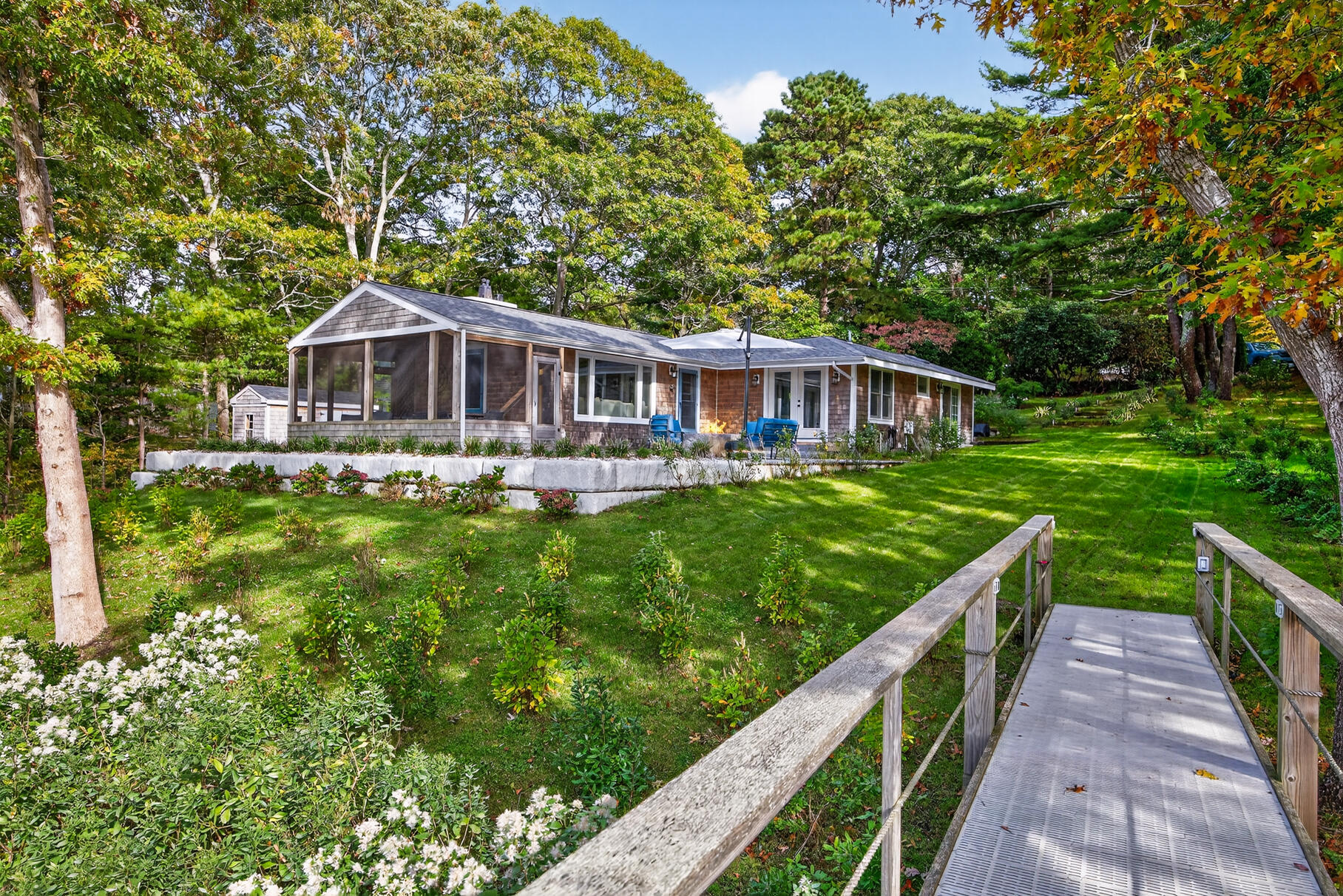 23 Childs River Road East Falmouth, MA 02536 - Photo 3 of 34 a house view with a garden space