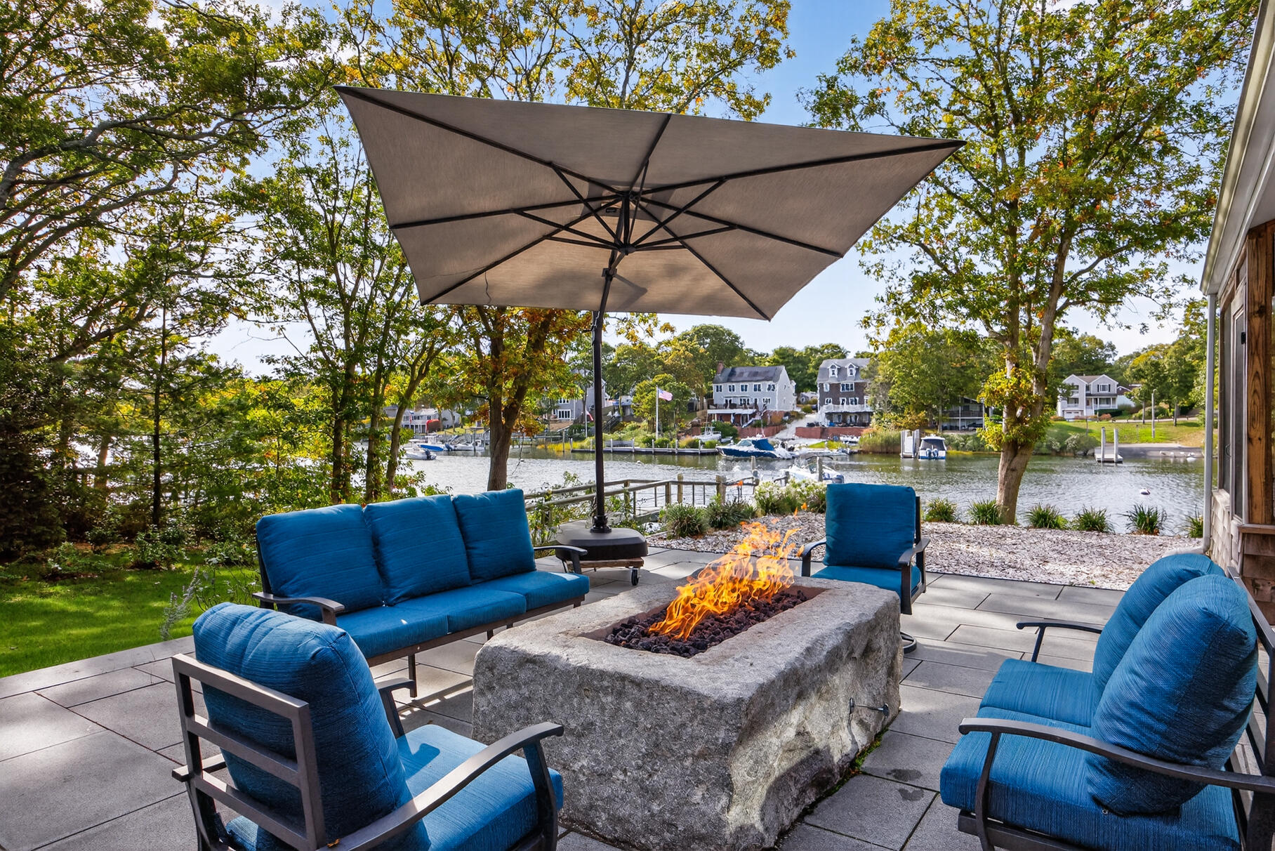 23 Childs River Road East Falmouth, MA 02536 - Photo 4 of 34 a outdoor space with patio the couches and a umbrella