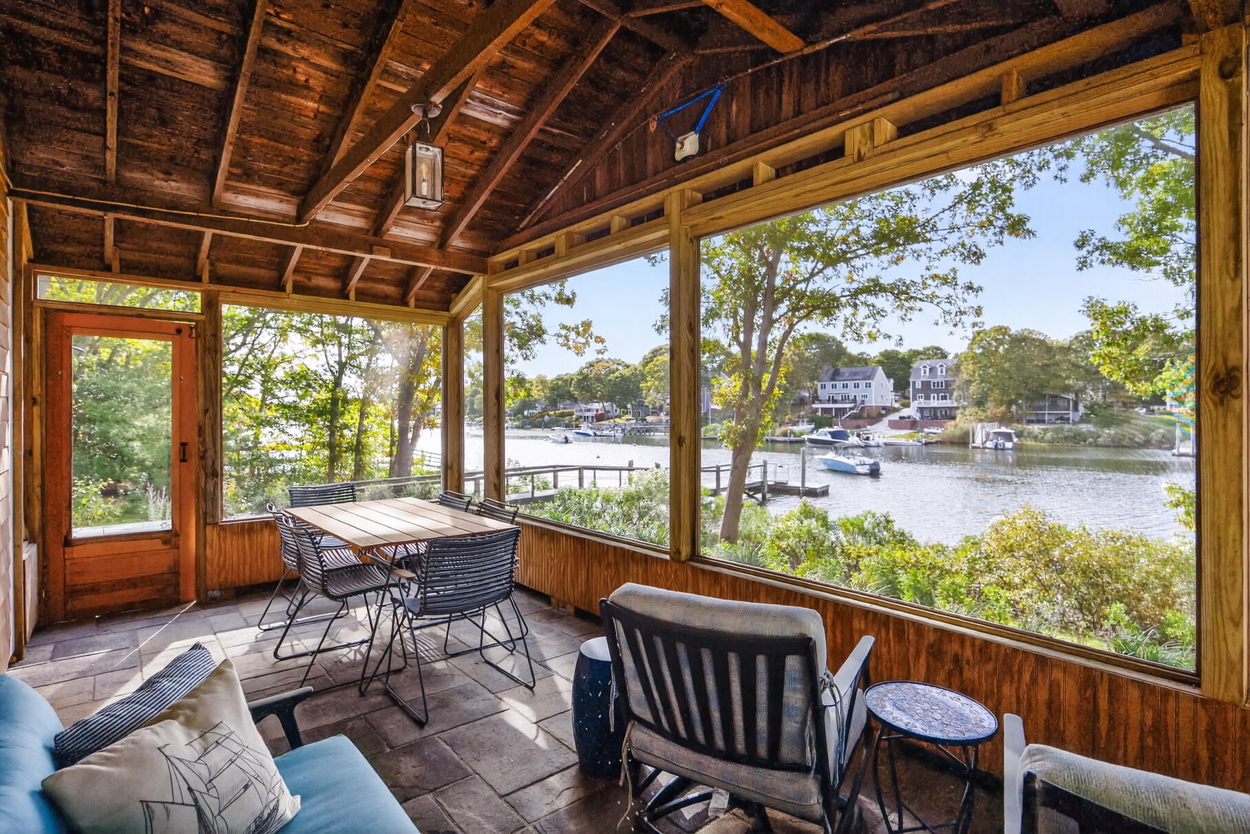 23 Childs River Road East Falmouth, MA 02536 - Photo 5 of 34 a view of a porch with furniture and a yard