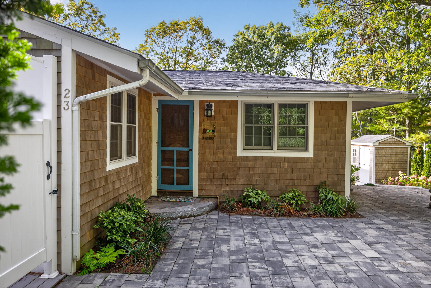 23 Childs River Road East Falmouth, MA 02536 - Photo 8 of 34 a front view of a house with garden