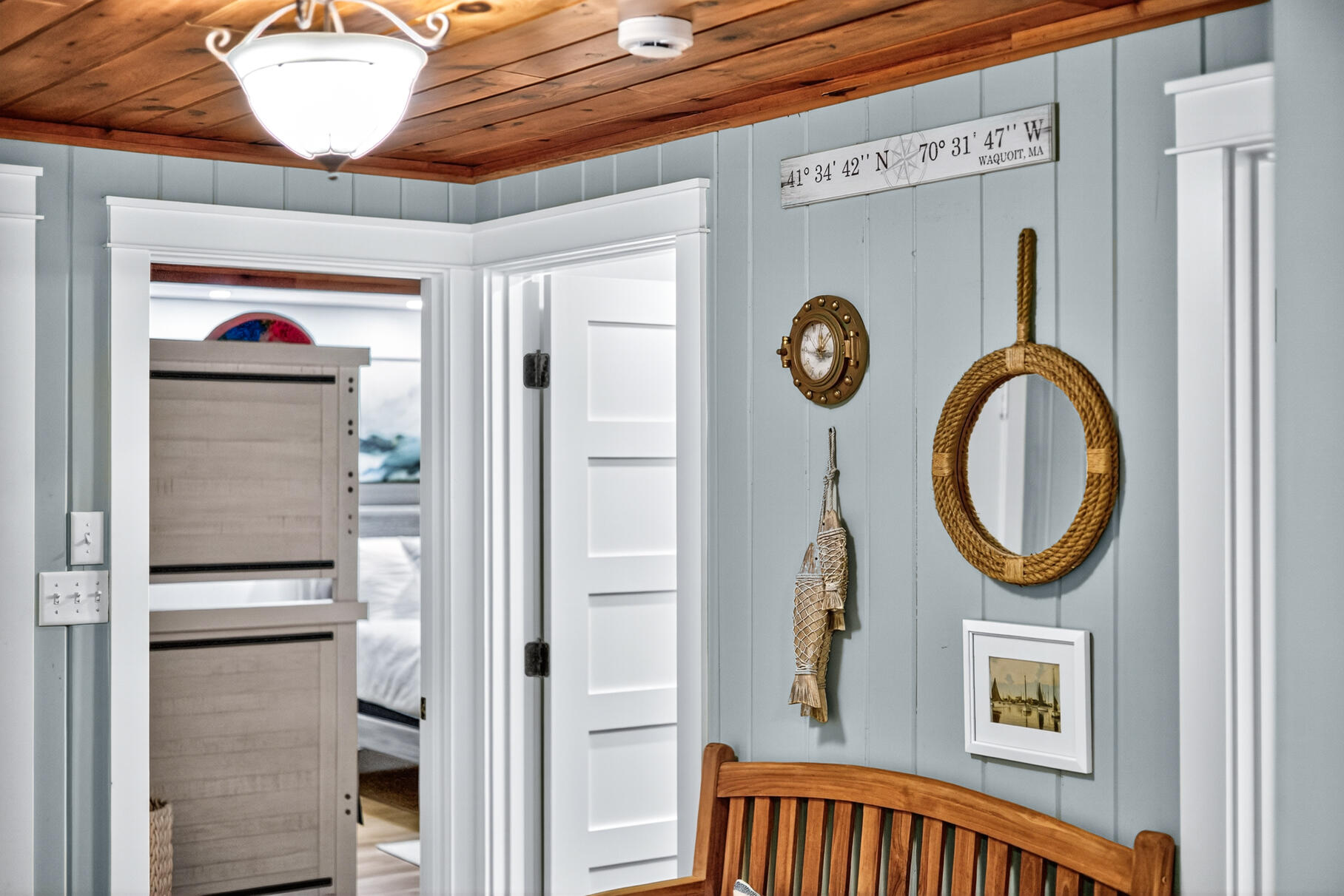 23 Childs River Road East Falmouth, MA 02536 - Photo 10 of 34 a view of a hallway with entryway wooden floor and front door
