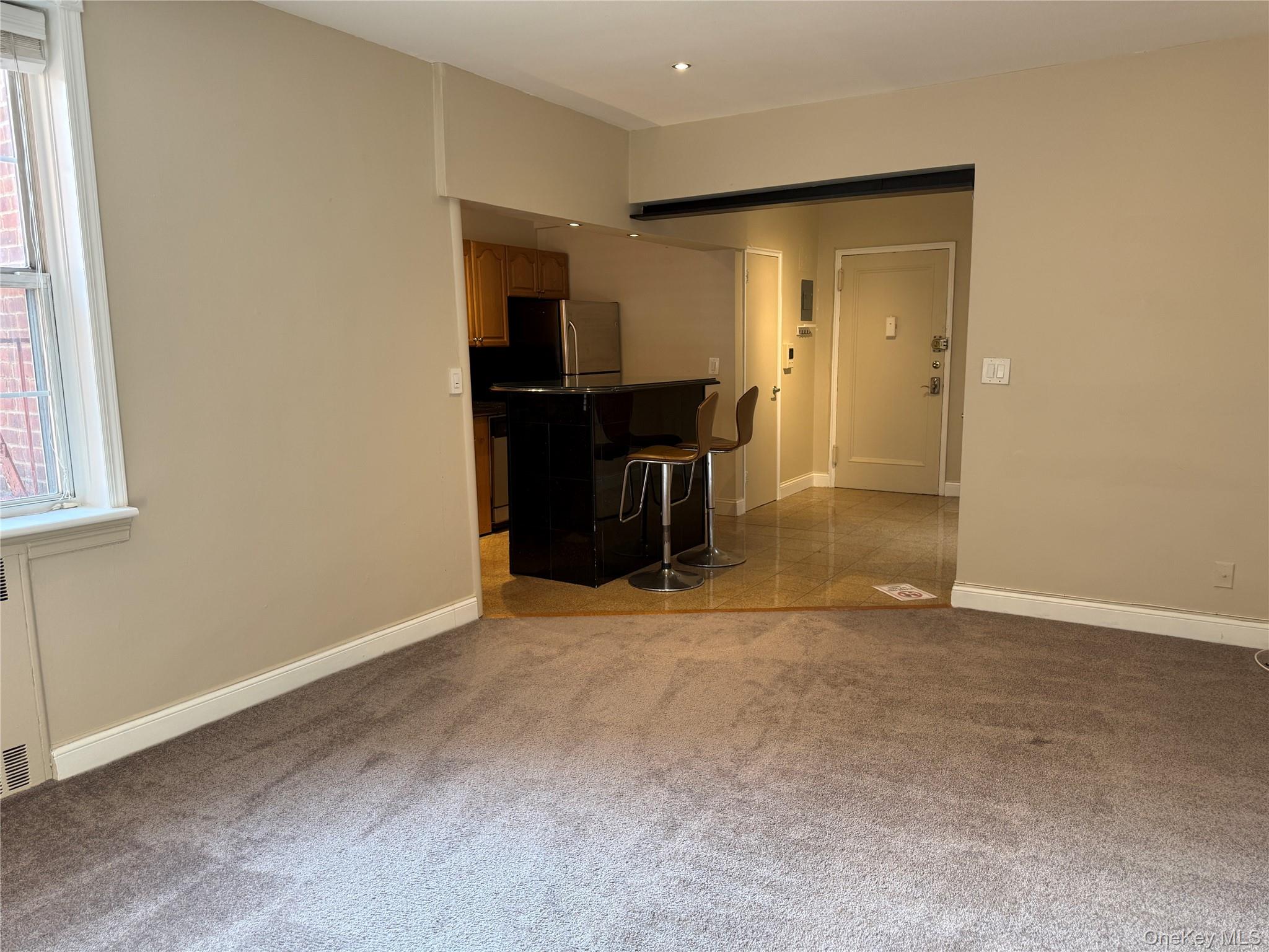 796 Bronx River Road, Unit B38 Bronxville, NY 10708 - Photo 5 of 31 an empty room with furniture and a window