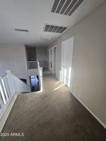 a view of an empty room with a fireplace