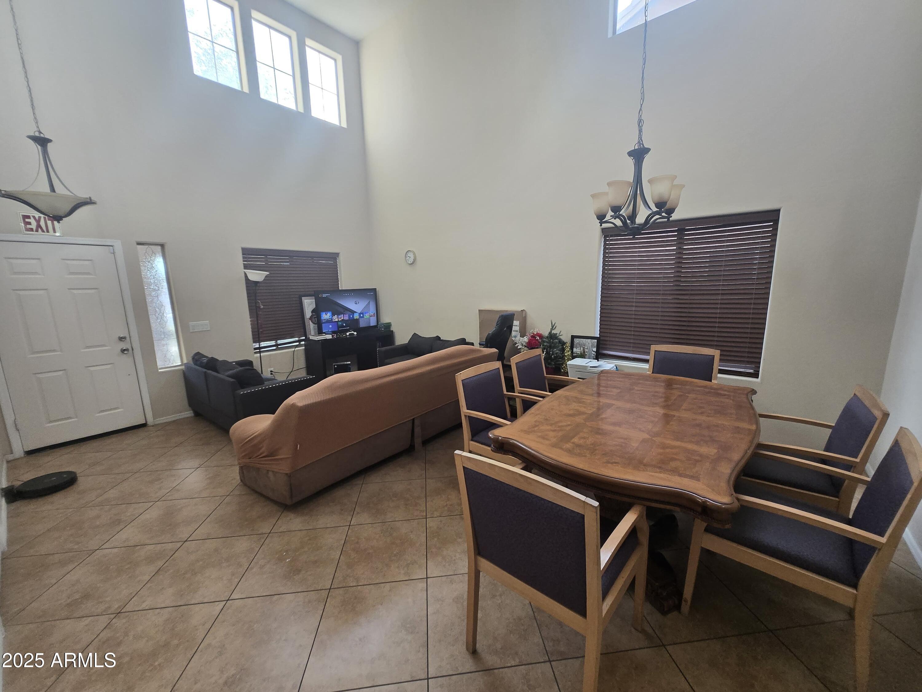 8814 West Magnolia Street Tolleson, AZ 85353 - Photo 3 of 19 a bed room with a bed and furniture