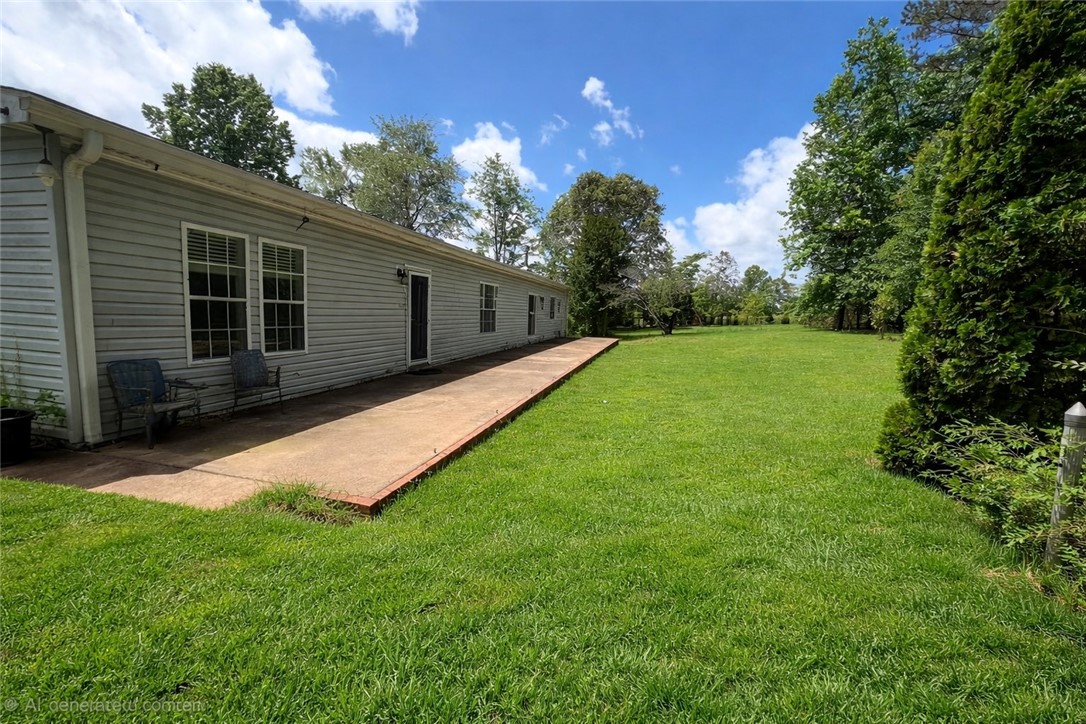 1400 Massey Road Pendleton, SC 29670 - Photo 2 of 25 This spacious property offers a vast lawn and a charming patio for outdoor enjoyment.