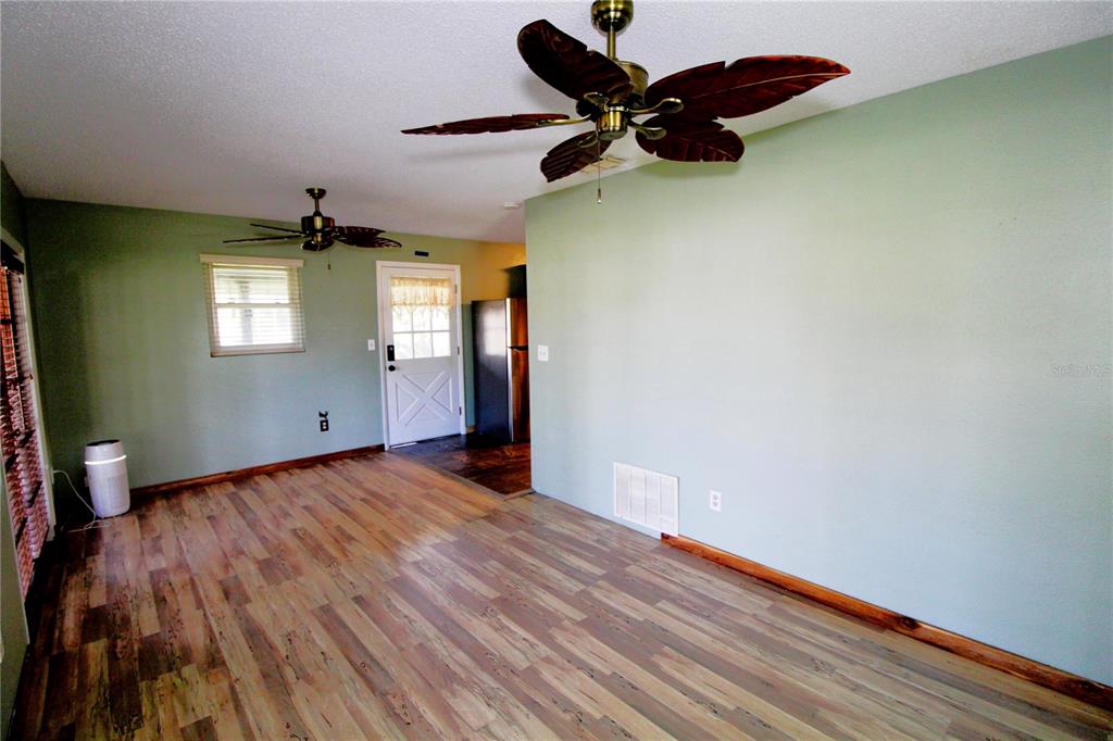 14712 Henson Road Orlando, FL 32832 - Photo 16 of 32 wooden floor in an empty room