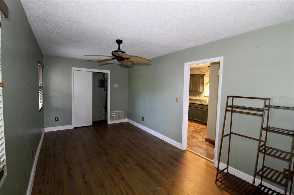 14712 Henson Road Orlando, FL 32832 - Photo 17 of 32 a view of empty room with wooden floor