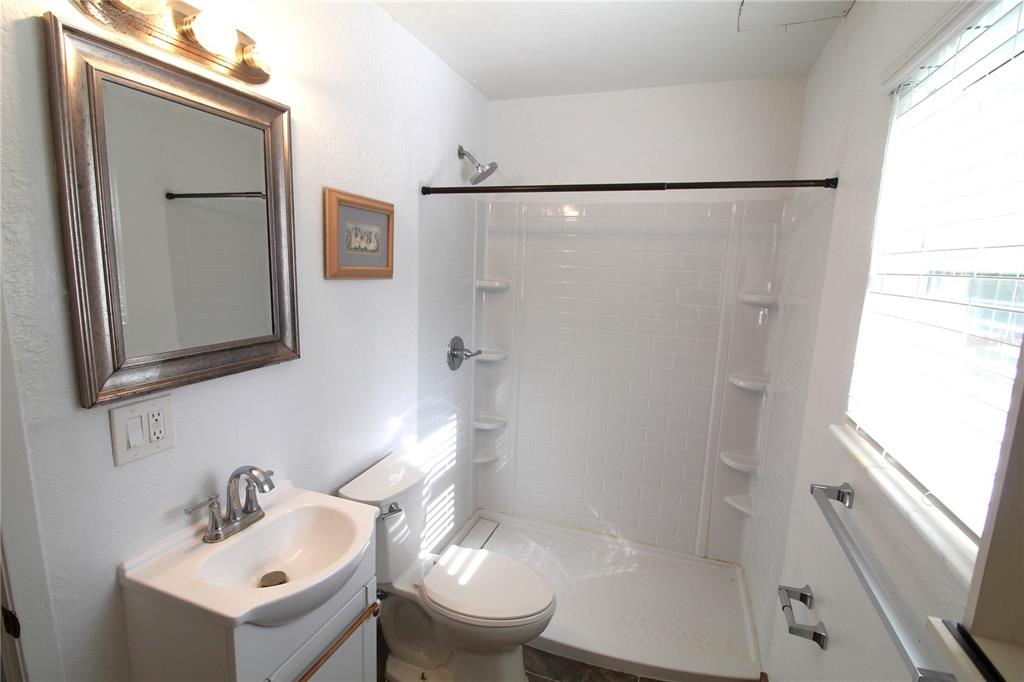 14712 Henson Road Orlando, FL 32832 - Photo 19 of 32 a bathroom with a sink toilet and shower