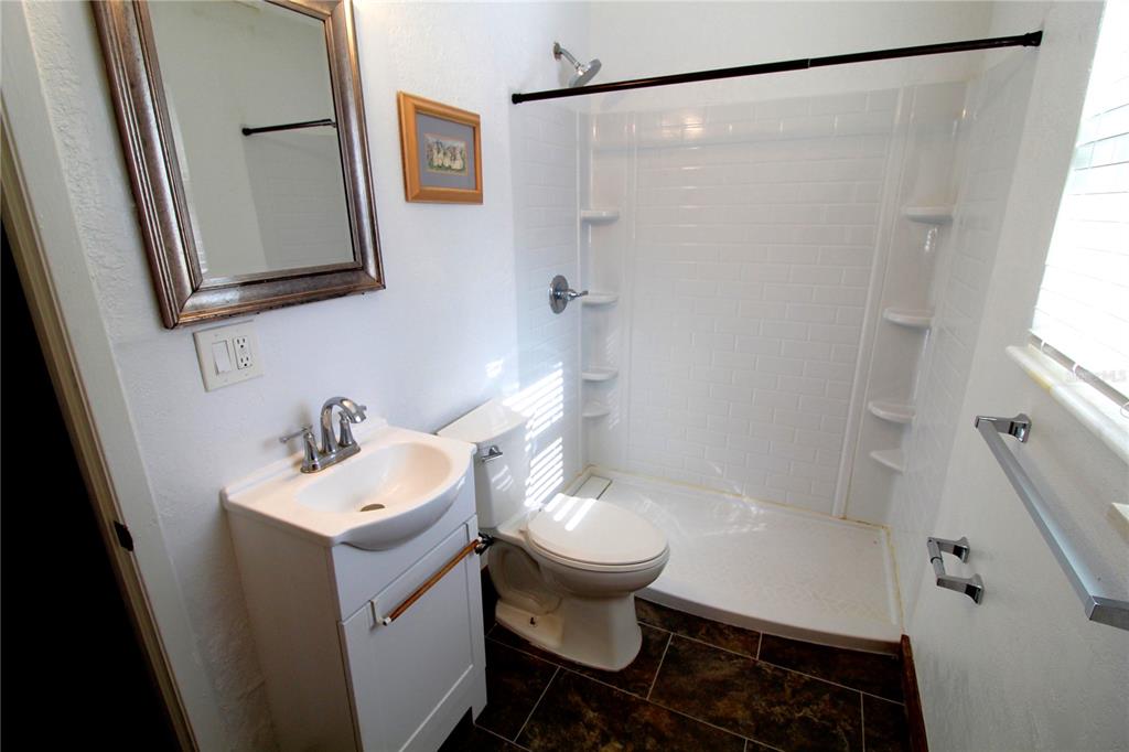 14712 Henson Road Orlando, FL 32832 - Photo 20 of 32 a bathroom with a sink toilet and shower